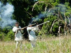 Soldiers firing muskets